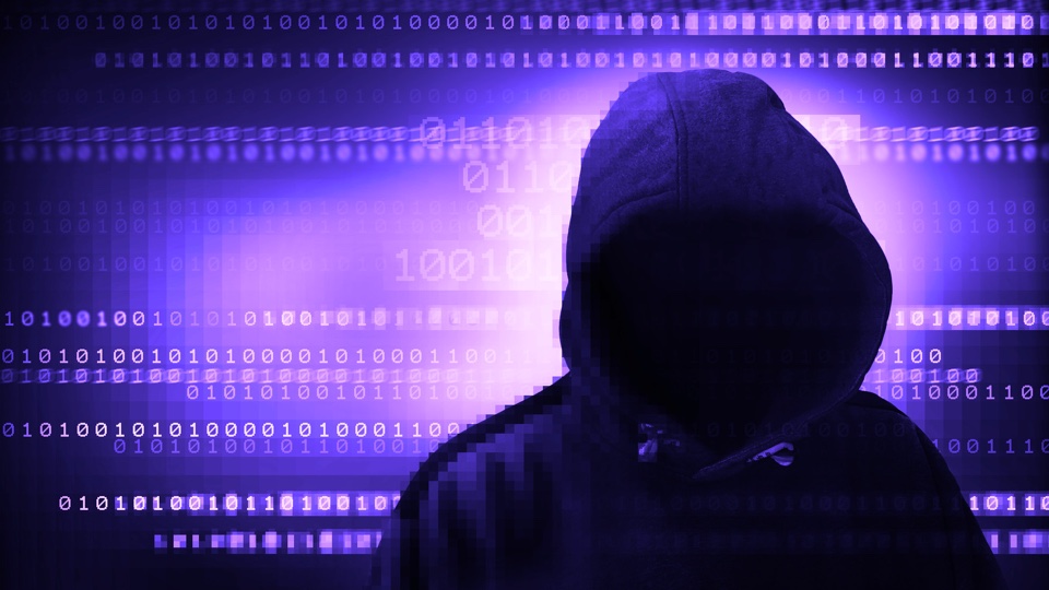 A purple hooded hacker (cc Flickr / Christoph Scholz)